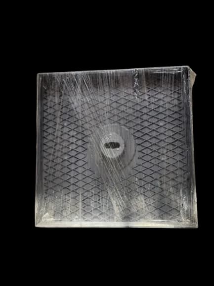 Square rubber base pad with a diamond-tread face and centre hole