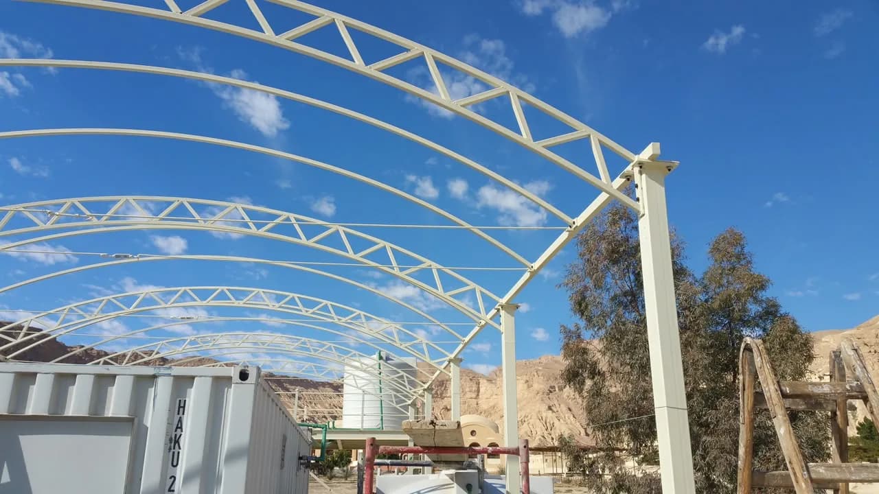 Steel canopy structure on fabricated columns and base plates